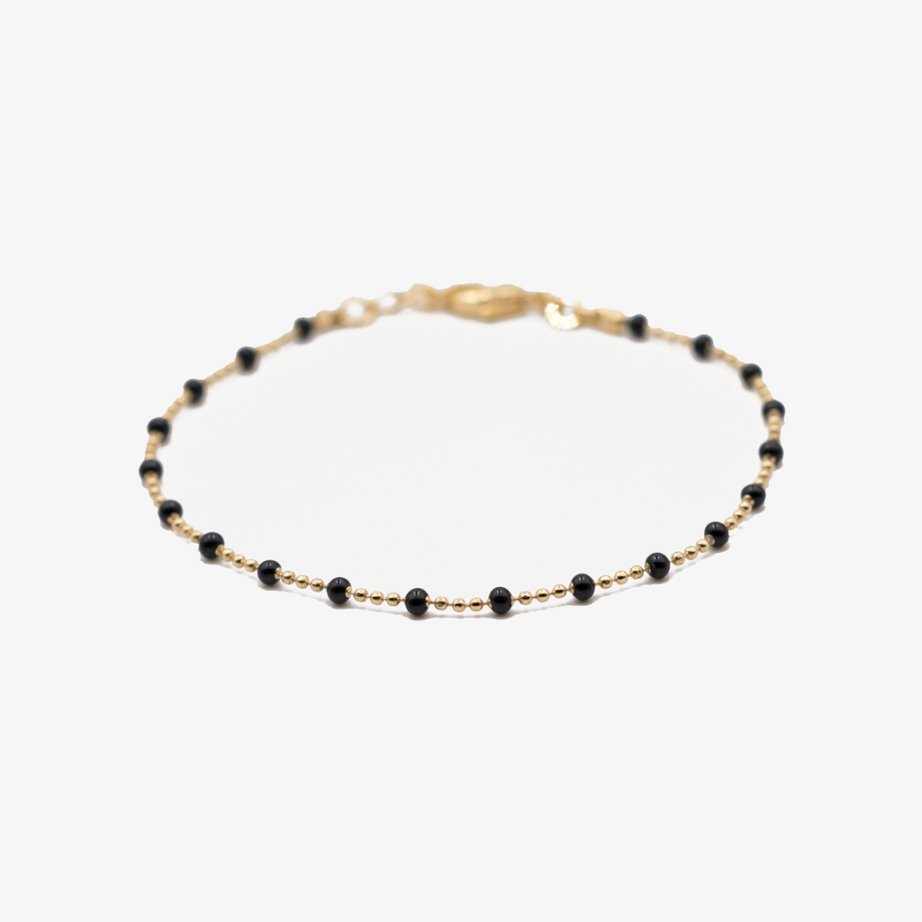 bracelet perles noires plaqué or